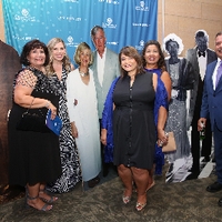 Guests posing with Lubbers' cardboard cutouts at Enrichment 2018